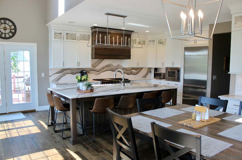 The finishes selected for this Bettendorf Iowa kitchen remodel are absolutely stunning! This before and after remodel story includes Amish-built cabinets, Cambria Quartz, Oak flooring, and Viking Appliance