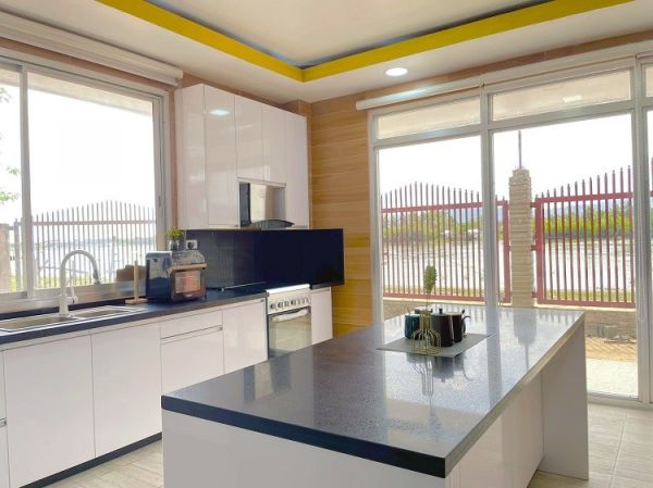 Modern kitchen brightens up a new riverside home