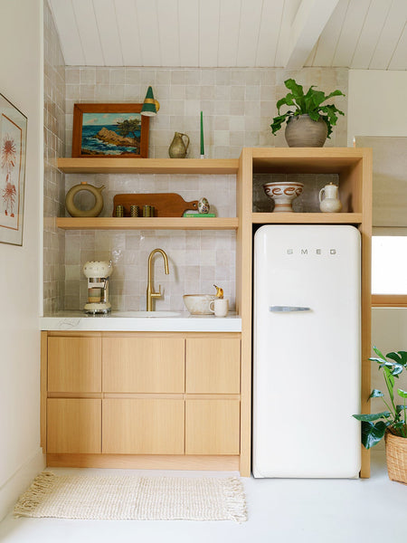 Oak-Wood Handles and Faux Drawers Are Murphy Bed Camouflage in This Guesthouse